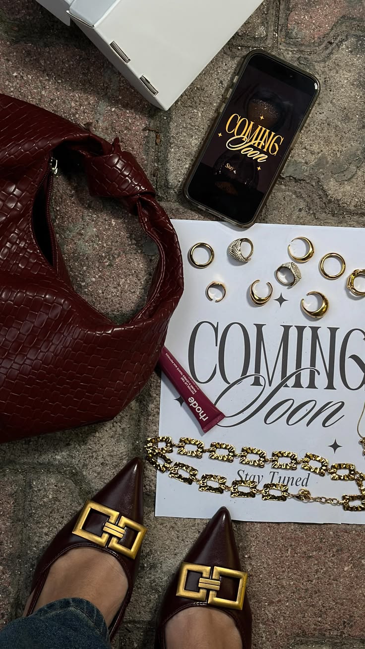 Burgundy and gold coming soon flatlay